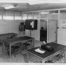 Interior view of the office and salesmen's check-in and order room for Old Home and Betsy Ross Bread for Pioneer Baking Company