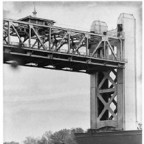 The center section of Tower Bridge raised from the road bed for boat access, a more close-up view