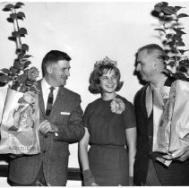 Sacramento's reigning 1964 Camellia Queen, Pamela Wyckoff visited Woodland to present camellia plants to Yolo County officials