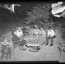 People relaxing on a patio