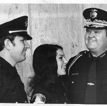 Duane Lowe chatting with new graduates of the Sheriff's Reserve Recruit Academy