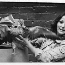 Elsa Herald, a librarian in the rehabilitation unit (State Department of Rehabilitation), which donated food including live animals to the needy at Christmas, holds a duck