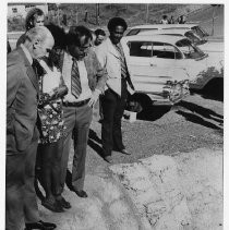 Alan Cranston US Senator, left inspects the Lincoln Ave. ditch in Redding, California, an open ditch which has posed health and safety issues for the neighborhood