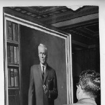 Goodwin Knight, Governor of California from 1953-1959. Here, another gentleman (back to camera, not identified) stands before Knight's official portrait in the Capitol