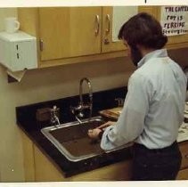 Photographs from Old Sacramento City Hotel Excavations, with unidentified archaeologists working in a lab