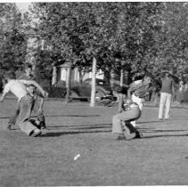 Boys Playing Football in Park