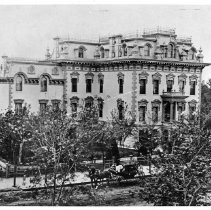 Stanford Home exterior view with horse-drawn carriage in front