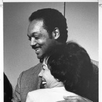 Jesse Jackson, the civil rights activist, founder of Rainbow/PUSH, and Baptist minister who ran for president in 1984 and 1988 and served as the first U.S. Shadow Senator from D.C. Teresa Hughes, D-L.A. is giving him a hug after a speech