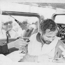 Dr. Alvin Marks, pilot and owner of Skymark Airlines. Here, surrounded by press after the flight