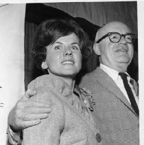 View of Judy Marie Olive, 1966 Camellia Festival Queen poses with Charles Butter of the Camellia Society during the festivities