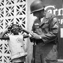 National Guard Soldier Speaks with Child