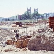 Site of the Downtown Plaza Parking Garage, Lot "G" near Macy's Department Store, 4th, 5th K and L Streets under construction. This view is looking east from the Fratt Building in Old Sacramento