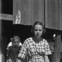 Alma and Edna with a crate of plums