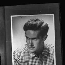 A young man in a checked shirt