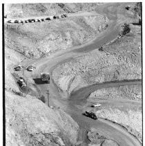 Construction vehicles haul rock and dirt at the Auburn Dam site