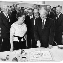 Mrs. Kenneth Hammacher watches as her husband [is] honored by fellow postal workers. Hammaker marked his 15th year as head of the Sacramento post office