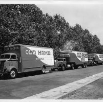 Exterior view of a fleet of Feeder Trucks for Old Home and Betsy Ross Bread for Pioneer Baking Company