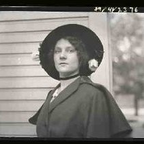 Woman wearing hat with flowers