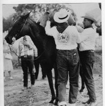 Bill Lance and Earle Lee Kelley trading mail pouches during the "re-run" of the Pony Express