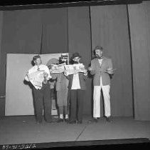 Four teenagers performing a skit