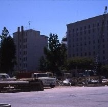 Demolition site at K and L, 12th and 13th Streets for the new Hyatt Hotel in 1984. A State of California building and a public parking lot occupied the site