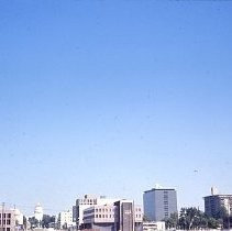 Views of redevelopment sites showing the demolition of buildings and reconstruction in the district. This view shows the skyline in downtown Sacramento