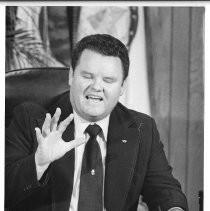 Duane Lowe, seated at his desk and gesturing