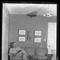 A man seated on a sofa