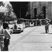 A tram on K Street Mall, with Cathedral in background