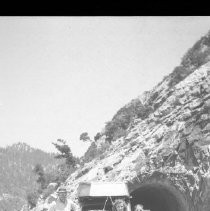 Family posing in front of auto
