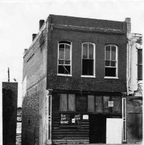 Photograph of Rivett Building in Old Sacramento, prior to restoration, 2nd Street side