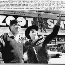 Cesar Chavez, President of United Farm Workers, outside the Winter Garden Theatre where "Zoot Suit" is playing. Also shown are the play's author-director Luis Valdez