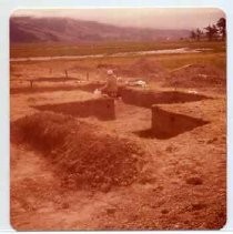 Photographs of Bolinas Bay. Unidentified archaeologist working in trench