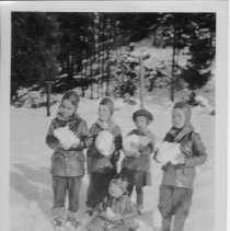 Schmittgen children playing in snow--from the scrapbook "Flora Schmittgen: This Is Your Life - April 7, 1955