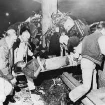 Injured Passenger Carried to Ambulance