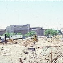 Site of the Downtown Plaza Parking Garage, Lot "G" near Macy's Department Store, 4th, 5th K and L Streets under construction. This view is looking east from the Fratt Building in Old Sacramento
