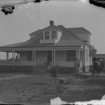 Exterior view of a family with a horse and buggy in front of the Morrow residence on Sunset Ave. near New York Streets in Fair Oaks