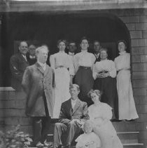 View of twelve people posing on the steps of a house in Fair Oaks