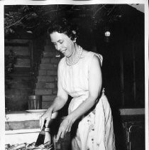 Ida Harrington Hill preparing chicken at barbeque