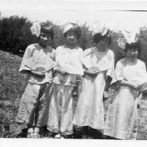 Four young girls in Chinese costumes