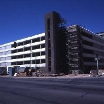 Site of the Downtown Plaza Parking Garage, Lot "G" near Macy's Department Store, 4th, 5th K and L Streets under construction. This view is looking east from the Fratt Building in Old Sacramento