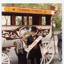 Photographs from Neasham Circle Ceremony in Old Sacramento. Irene Neasham and Bill Gaylord in front of old wagon with street sign