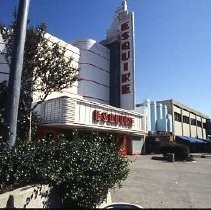 Views of redevelopment sites showing hotels, theaters, restaurants and other businesses. This view shows the Esquire Theater