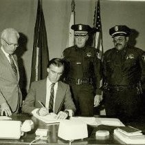 Governor Signing Document