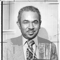 Dr. Carlton Goodlett, president of the National Negro Publishers Association, holding NAACP's Distinguished Service Award