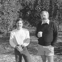 Two Men in an Orchard