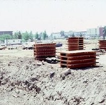 Site of the Downtown Plaza Parking Garage, Lot "G" near Macy's Department Store, 4th, 5th K and L Streets under construction. This view is looking east from the Fratt Building in Old Sacramento