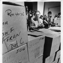 Howard Jarvis, businessman, lobbyist and anti-tax advocate behind Proposition 13, shown here with boxes of letters supporting Prop 13 at a Capitol news conference