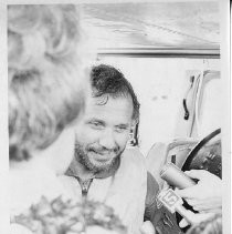 Dr. Alvin Marks, pilot and owner of Skymark Airlines. Here, with his wife Phoebe after record-breaking flight, being interviewed by reporters