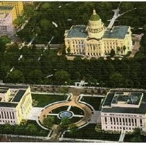 Aerial view of the west side of the California State Capitol building in Sacramento. Across 10th street is the State Office Building on the left and the State Library on the right. View is looking east